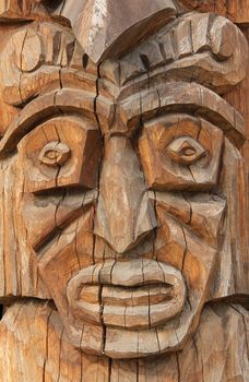 Wooden carved African ritual near the statue face.