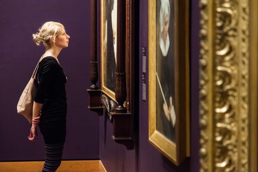 Editorial - Montreal, Canada - Montreal Fine Arts Museum Room with Paintings on the wall and Young Adult looking at it.