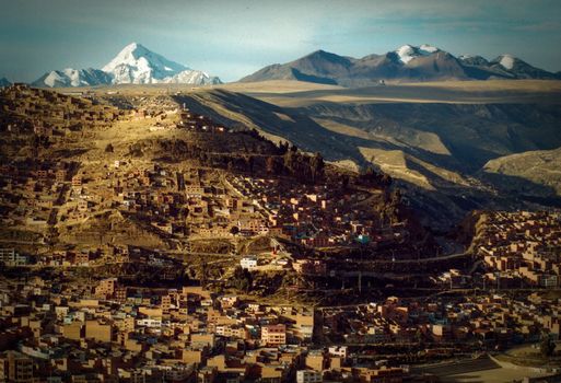 Houses in a town with a mountain range in the background, Macrodistrito Maximiliano Paredes, La Paz, Bolivia