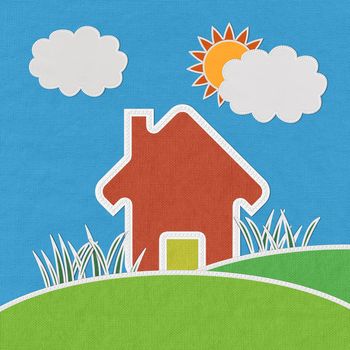House on green grass  with stitch style on fabric background