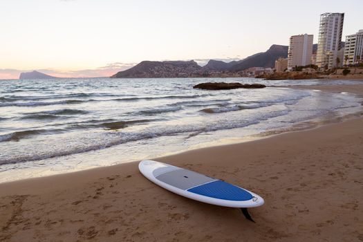 Calpe Alicante sunset at beach Cantal Roig in Mediterranean Spain with paddle sufboard