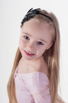 Portrait of blond girl with long hair in studio