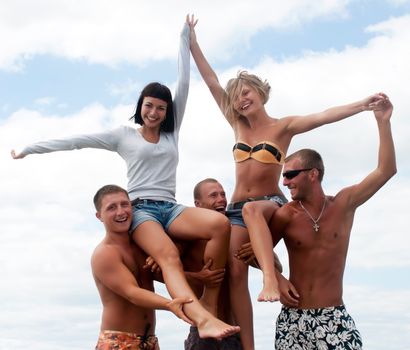 Group of friends having fun at the beach 