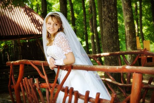 Portrait of the young bride in park