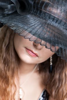 Young woman in a hat portrait