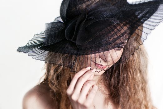 Young woman in a hat portrait