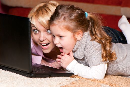 picture of happy mother and child with laptop computer 