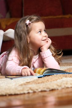 sweet  little girl reading book