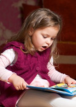 sweet  little girl reading book