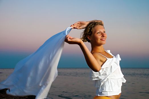 Girl with kerchief on the sunset