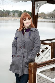 Portrait of a beautiful woman on the bank of lake