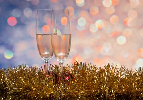 Glasses with champagne on an abstract background 