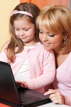 picture of happy mother and child with laptop computer 