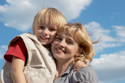 Portrait of happy family playing outdoors.

