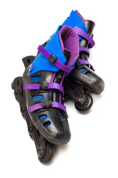 old roller skates on a white background