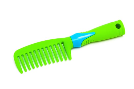 green plastic hairbrush on a white background
