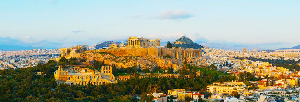 Scenic overview of Athens with Acropolis in the evening