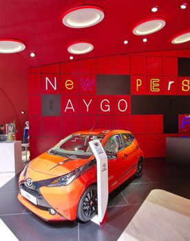 GENEVA - MARCH 13 : orange Aygo Toyota on display at the 84th International Motor Show Palexpo - Geneva on March 13, 2014 in Geneva, Switzerland.