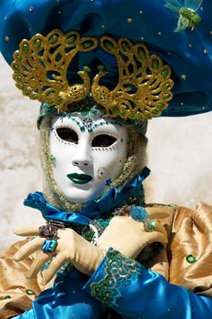 Blue and yellow person at the 2014 venetian carnival of Annecy, France