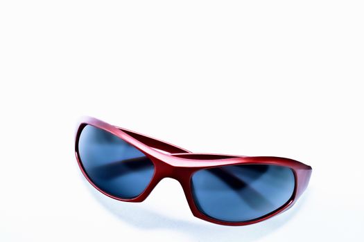 Sleek red plastic sunglasses with dark non reflective lens. 