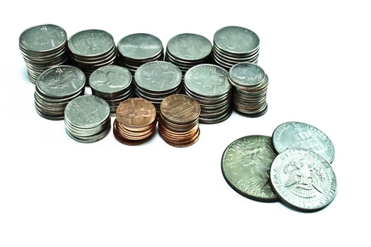 Stacks of pennies, dimes, nickels, and quarters. Different sizes. Silver dollar and two half dollars on the side. 