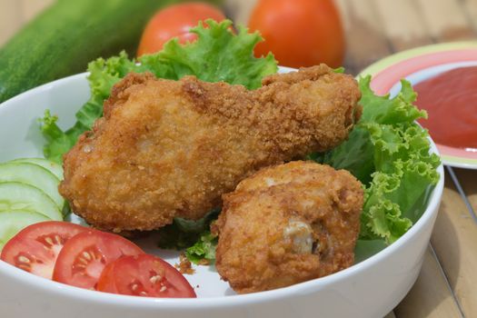 Fried chicken with dip sauce and vegetables