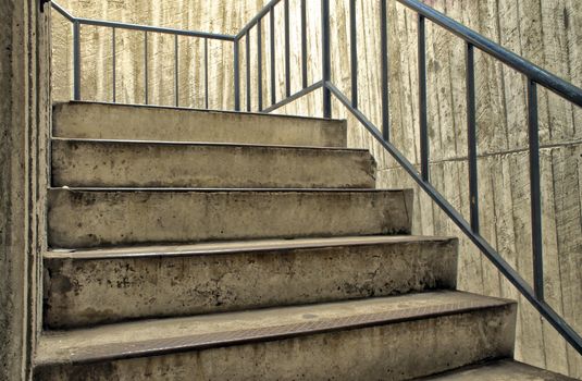 Staircase up the tower with metal railing.