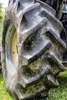 Closeup view of giant rubber tractor tire. 