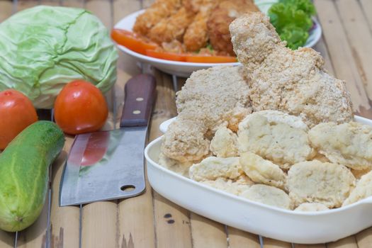 Breaded chicken products with vegetables