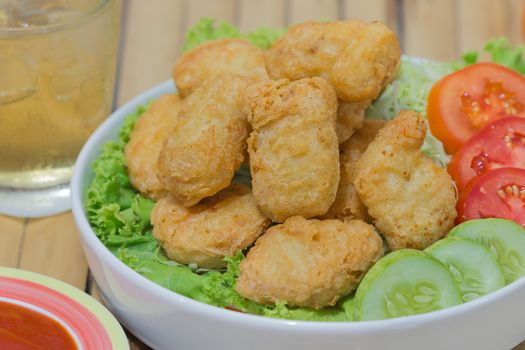 Fried chicken nuggets with dip sauce and Beer