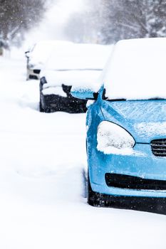 Parked Cars in the Street on a Snowstorm Winter Day