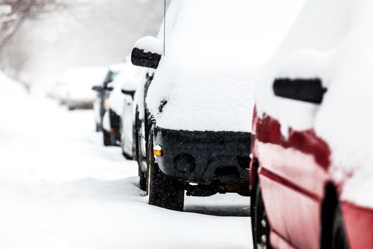 Parked Cars in the Street on a Snowstorm Winter Day