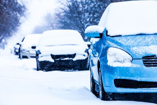 Parked Cars in the Street on a Snowstorm Winter Day