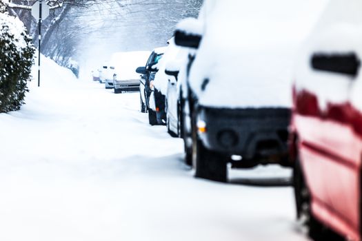 Parked Cars in the Street on a Snowstorm Winter Day