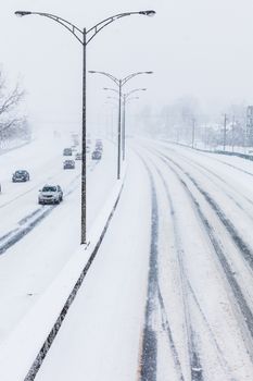 Close-up of Snowy Highway from Above on a Cold Blizzard Day of Winter