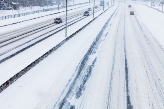 Close-up of Snowy Highway from Above on a Cold Blizzard Day of Winter