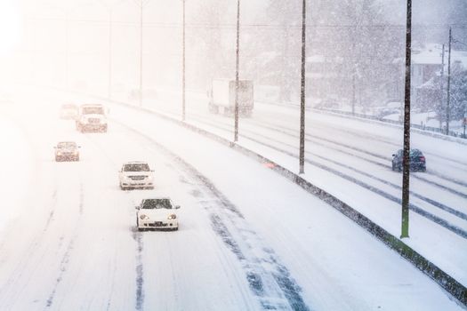 Disturbing Sunset Light and Snowstorm on Highway resulting of a Bad Visibility