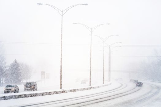 Disturbing Sunset Light and Snowstorm on Highway resulting of a Bad Visibility