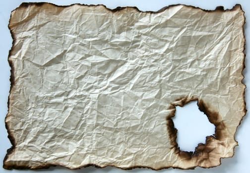 Old burnt crumpled edge paper, background