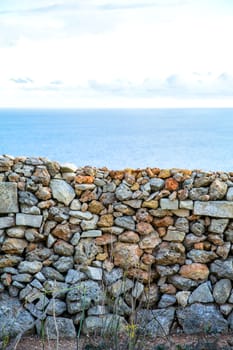 A antique wall in front of the Ocean in Dingli, Malta, Europe.