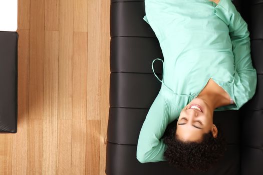 A jung brazilian woman relaxing on the sofa.