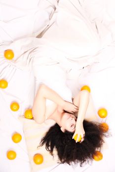 A young south american woman dreaming of fruits.