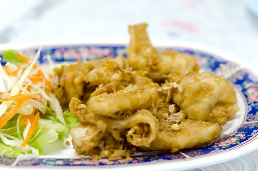 Squid with Garlic and placed in a dish at the table.