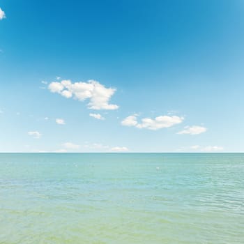 blue sea and sky with clouds