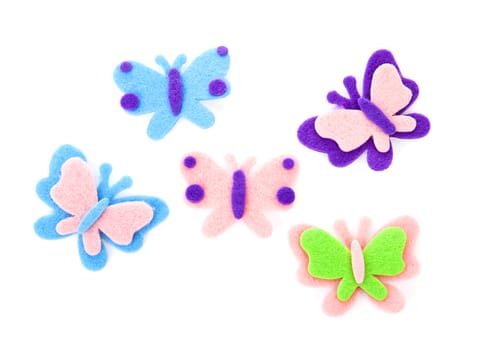 Five butterfly made of felt over white background