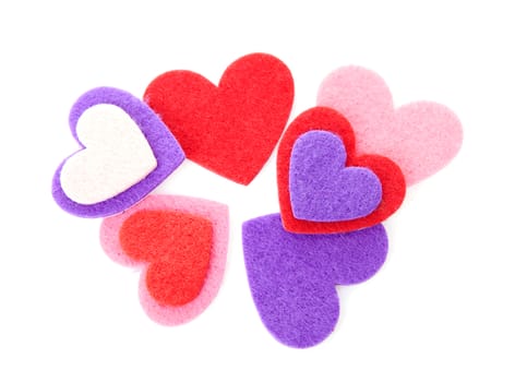 Couple of hearts made of felt over white background