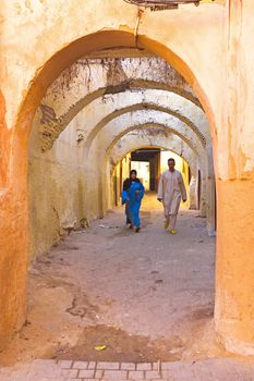 FES, MOROCCO - OCTOBER 22, People walking in the medina in Fes on Eid al-Adha. The festival is celebrated by sacrificing a lamb or other animal and distributing the meat to relatives, friends, and the poor.