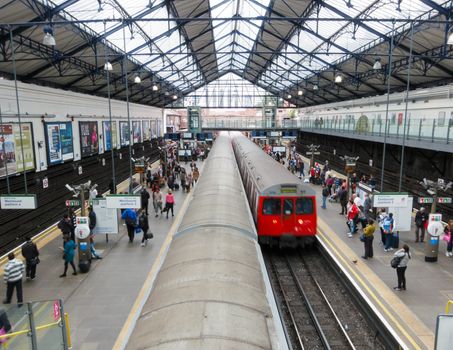 LONDON, UK - CIRCA AUGUST 2012: Train arrives at Earls Court underground station.
