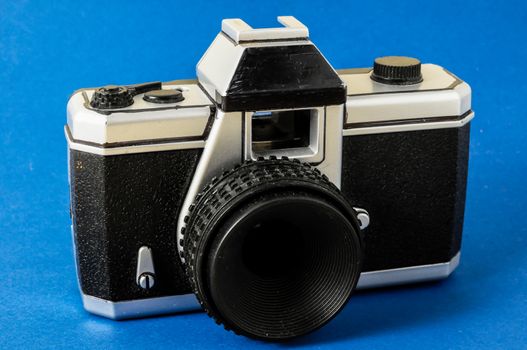 Classic 35mm Plastic Toy Photo Camera on a Colored Background