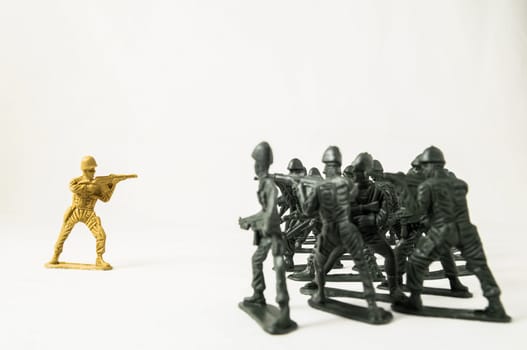 Plastic Lead Soldiers Representing War on a White Background